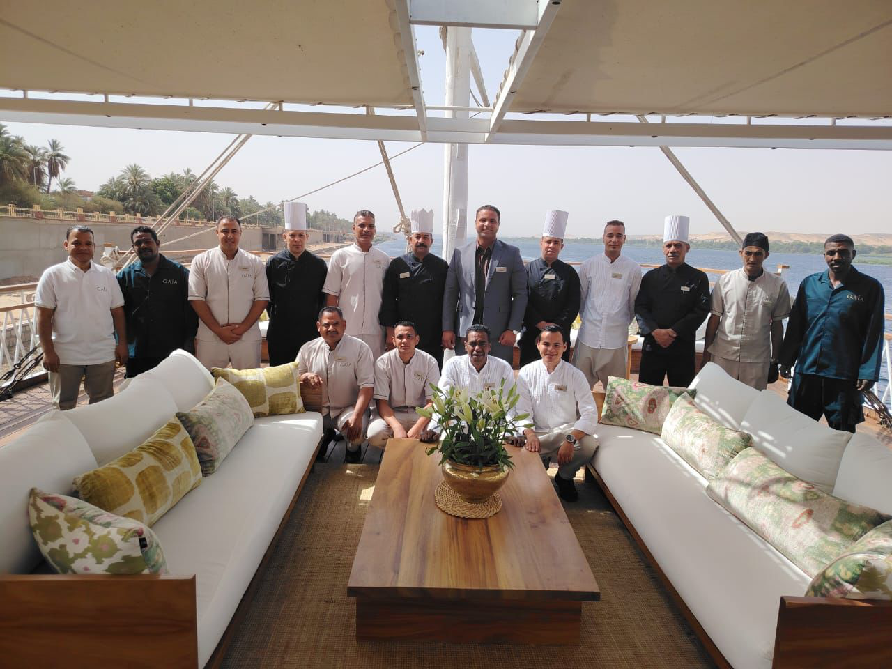 The Gaïa crew — chefs, butlers, and hosts on the upper deck